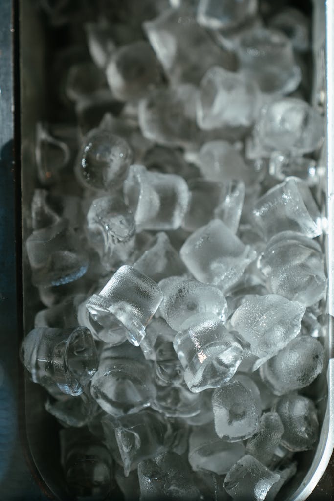 Clear Glass Container on Black Surface